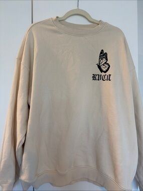 RVCA Cream Sweatshirt with Black Butterfly Logo
